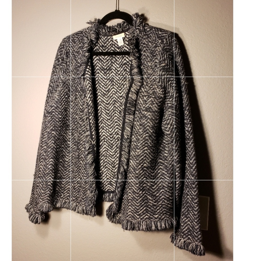 Long sleeve jacket with fringe.